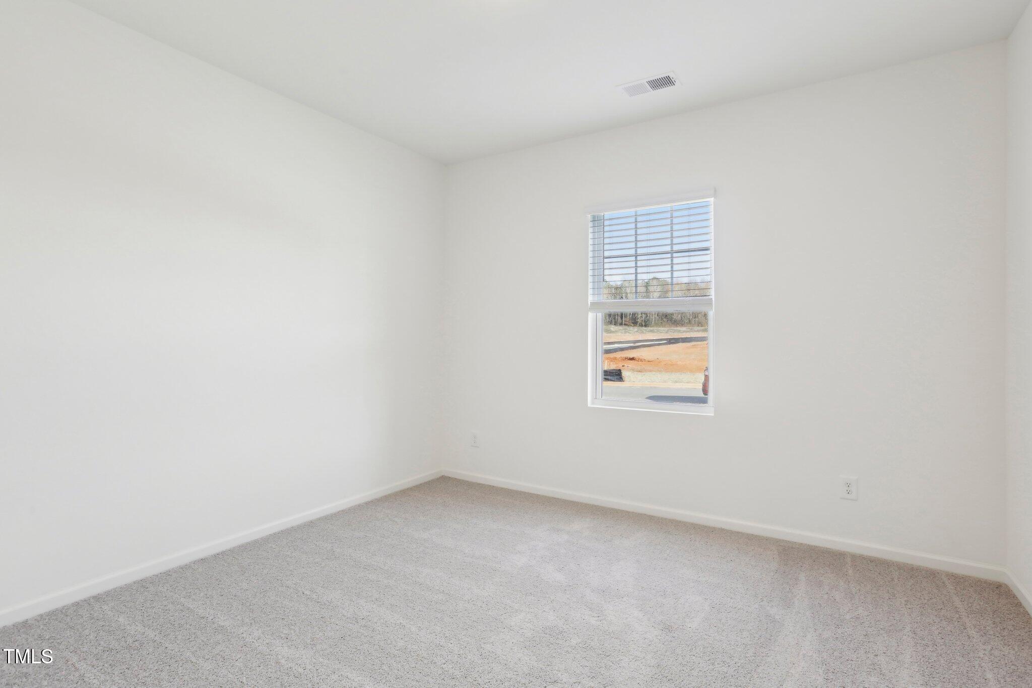 899 Embraer Way Spring Spring Hope, NC 27882 - Photo 29 of 43 an empty room with a window