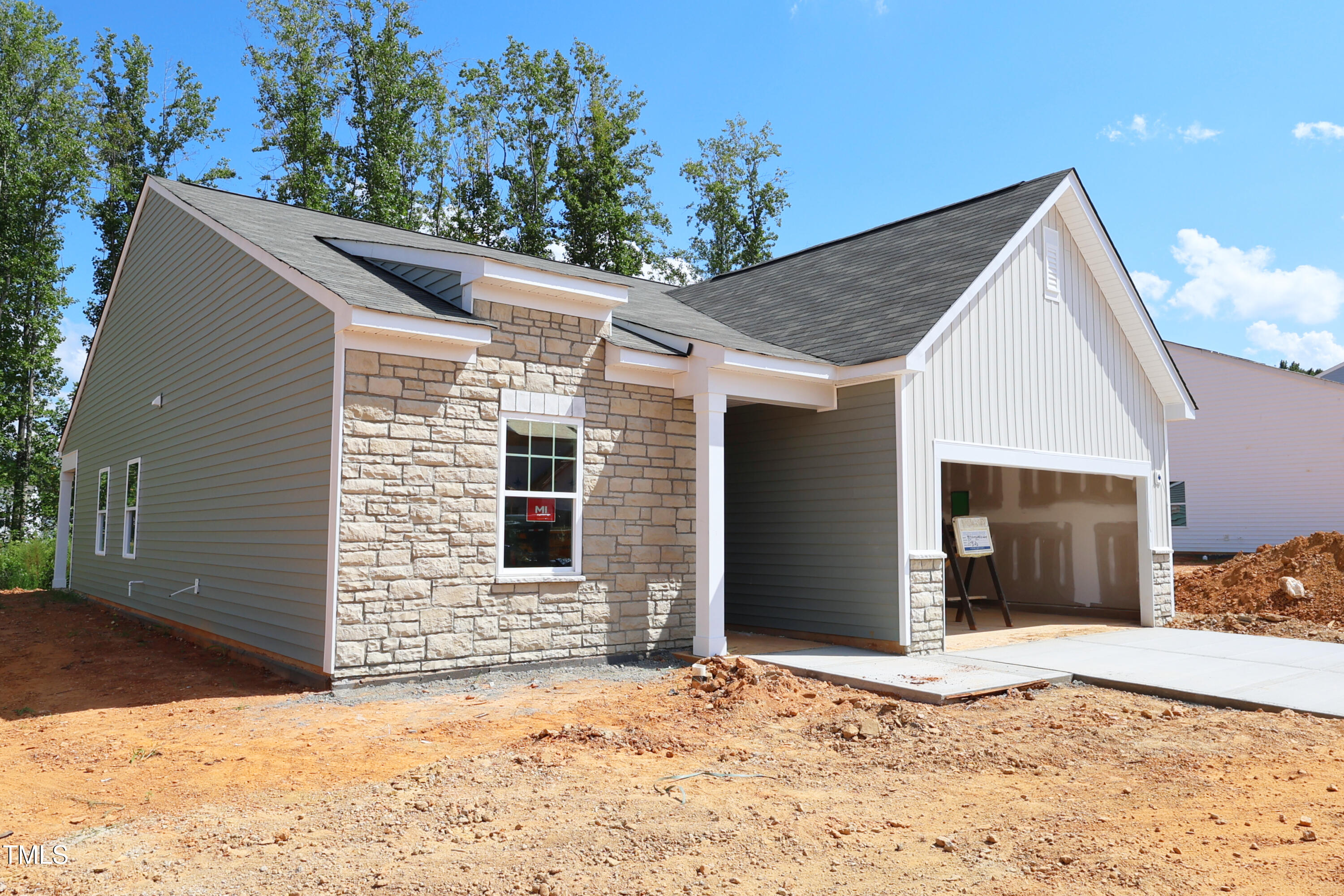 899 Embraer Way Spring Spring Hope, NC 27882 - Photo 41 of 43 a view of a house with a yard and garage