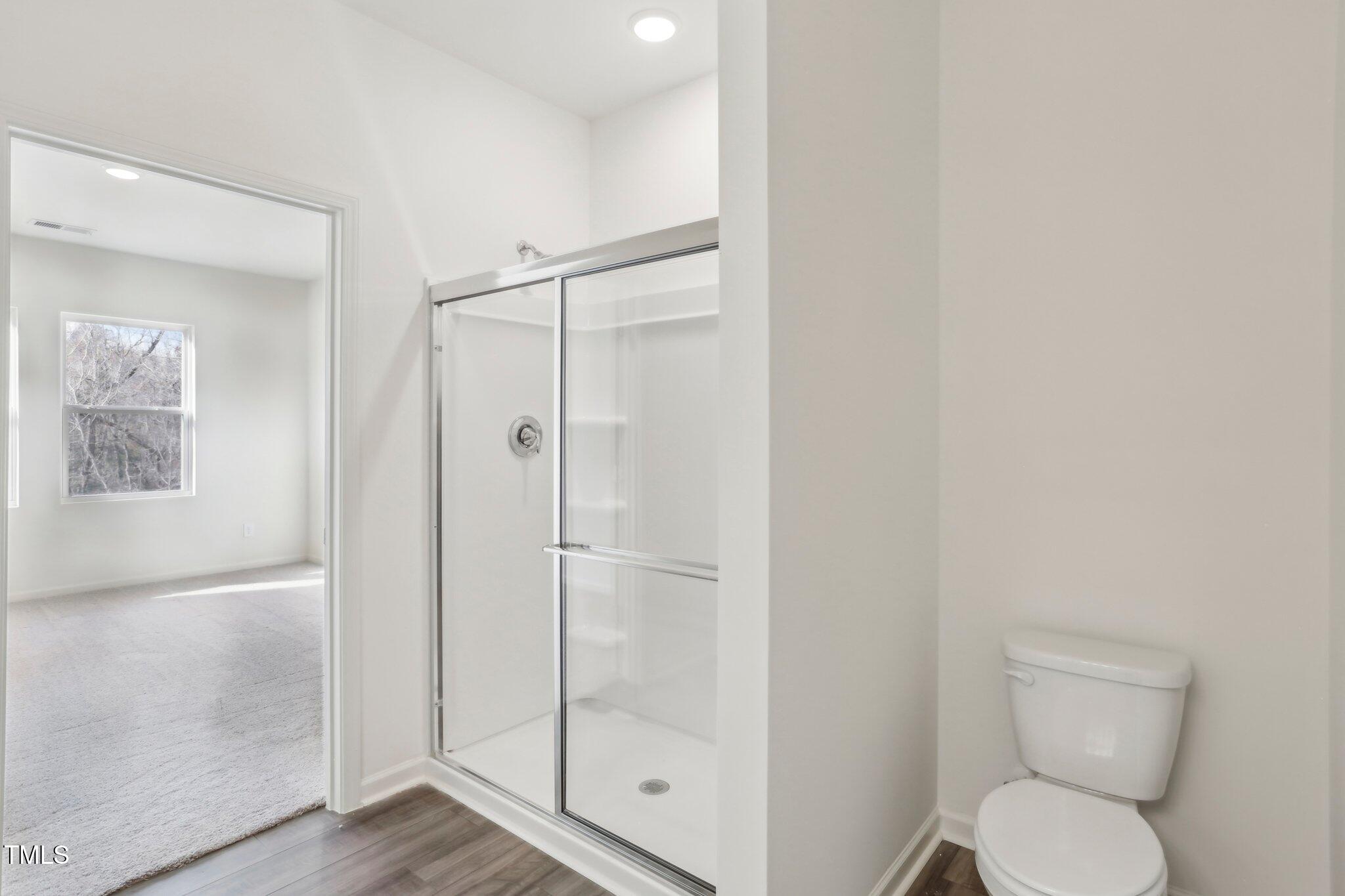 899 Embraer Way Spring Spring Hope, NC 27882 - Photo 5 of 43 a bathroom with a toilet and a shower