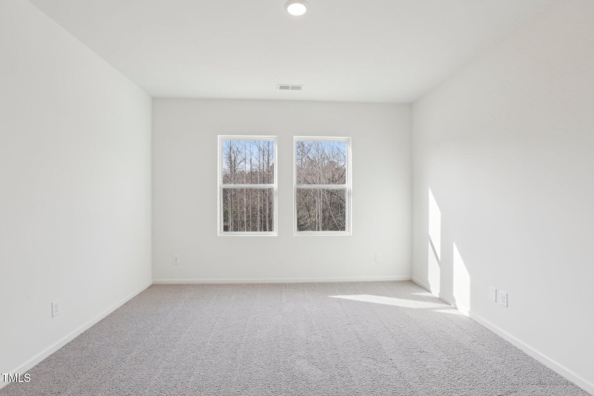 899 Embraer Way Spring Spring Hope, NC 27882 - Photo 10 of 43 an empty room with windows