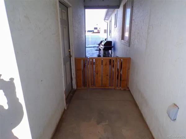 a view of hallway with mirror