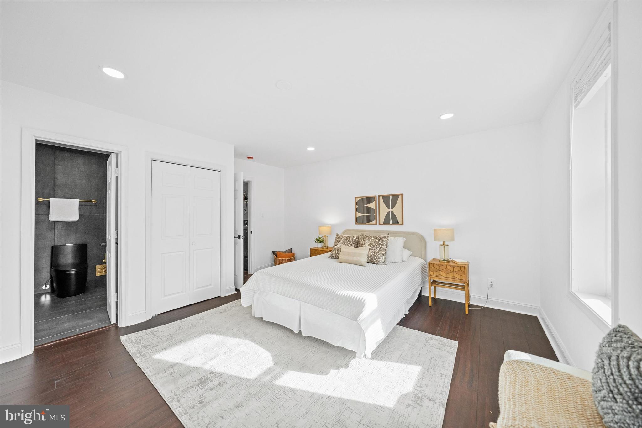 65 Bates Street Northwest Washington, DC 20001 - Photo 11 of 23 a bedroom with a bed and a couch