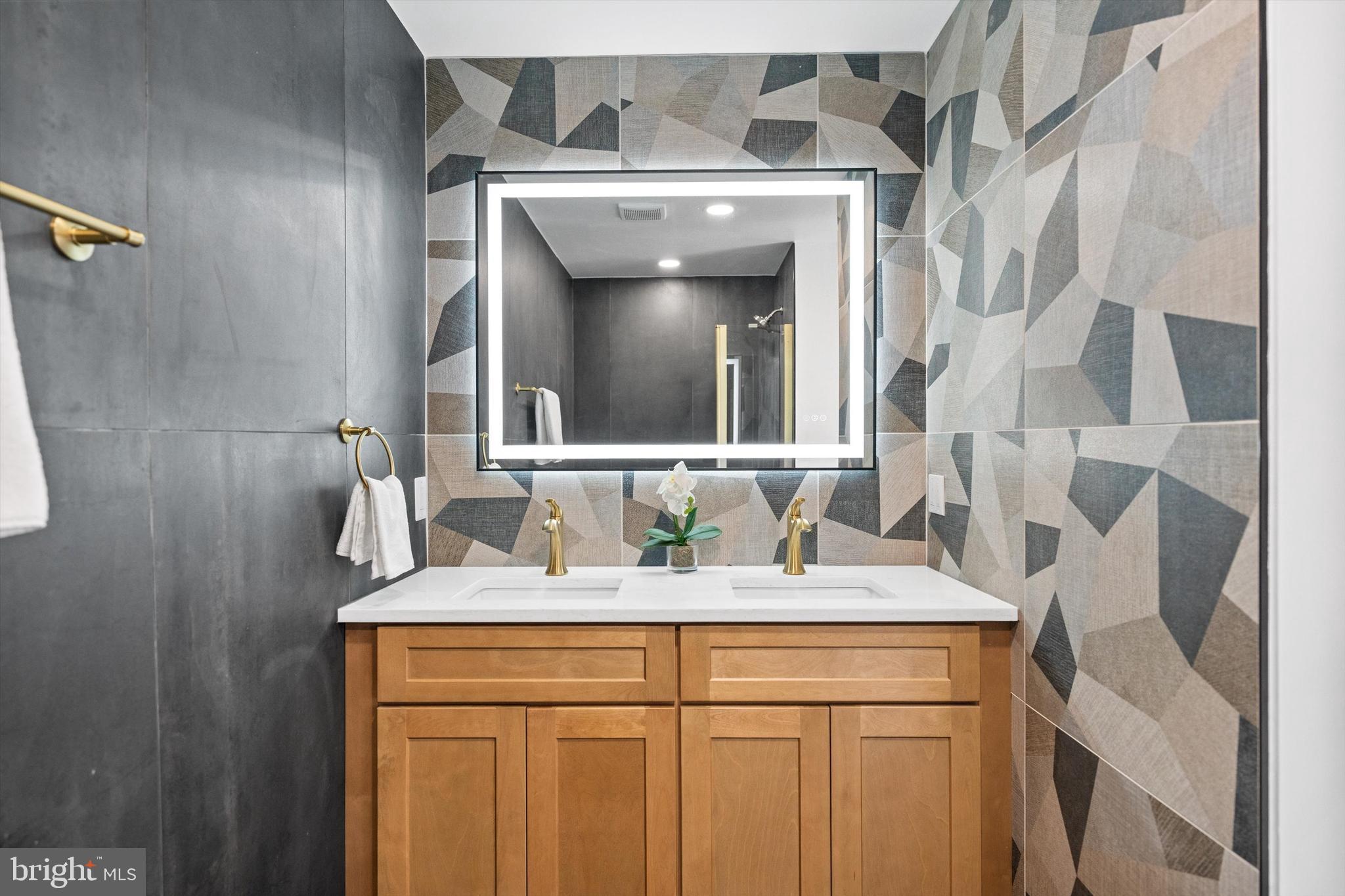 65 Bates Street Northwest Washington, DC 20001 - Photo 12 of 23 a bathroom with a sink and a mirror