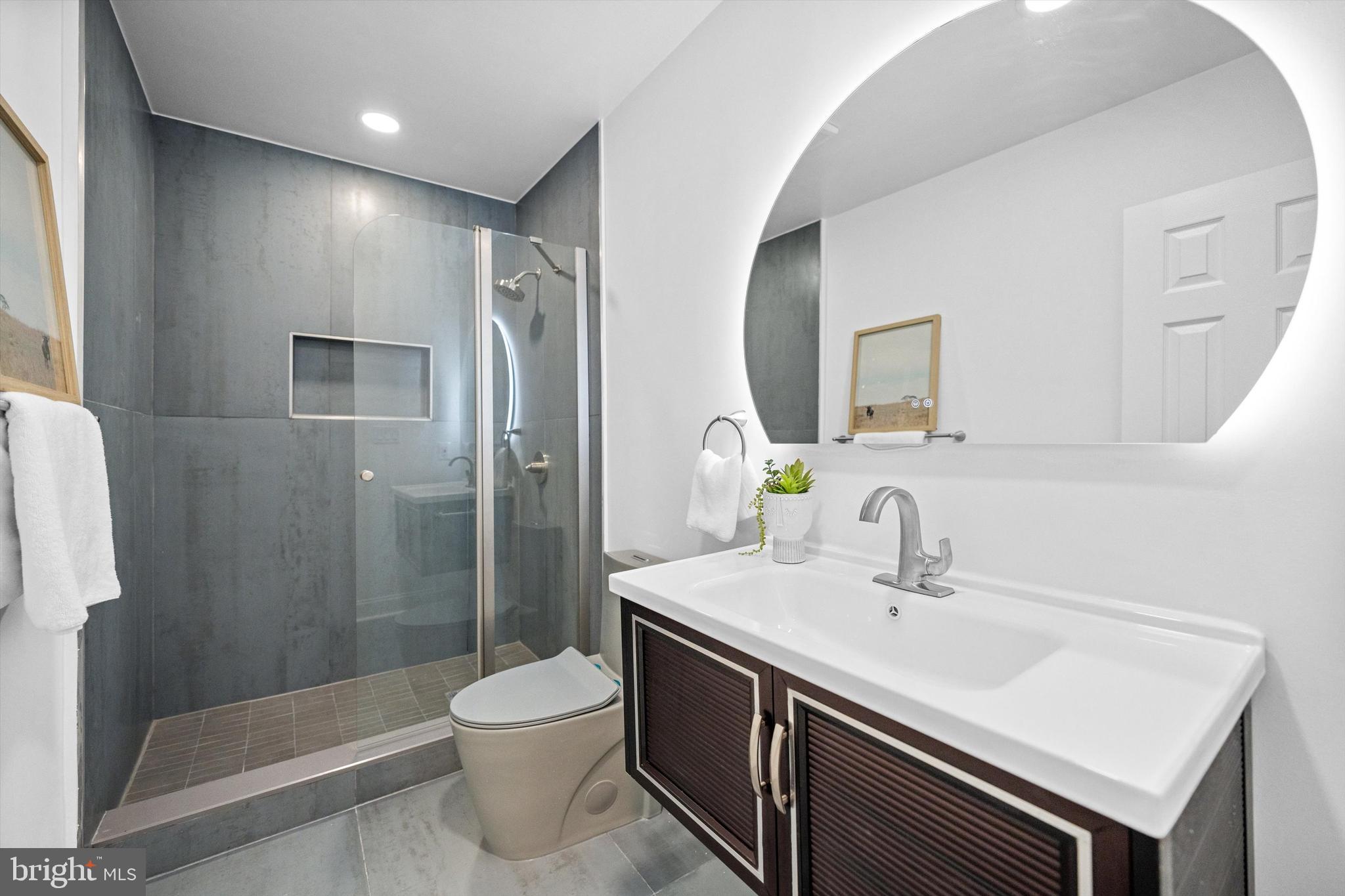 65 Bates Street Northwest Washington, DC 20001 - Photo 15 of 23 a bathroom with a sink a toilet and shower