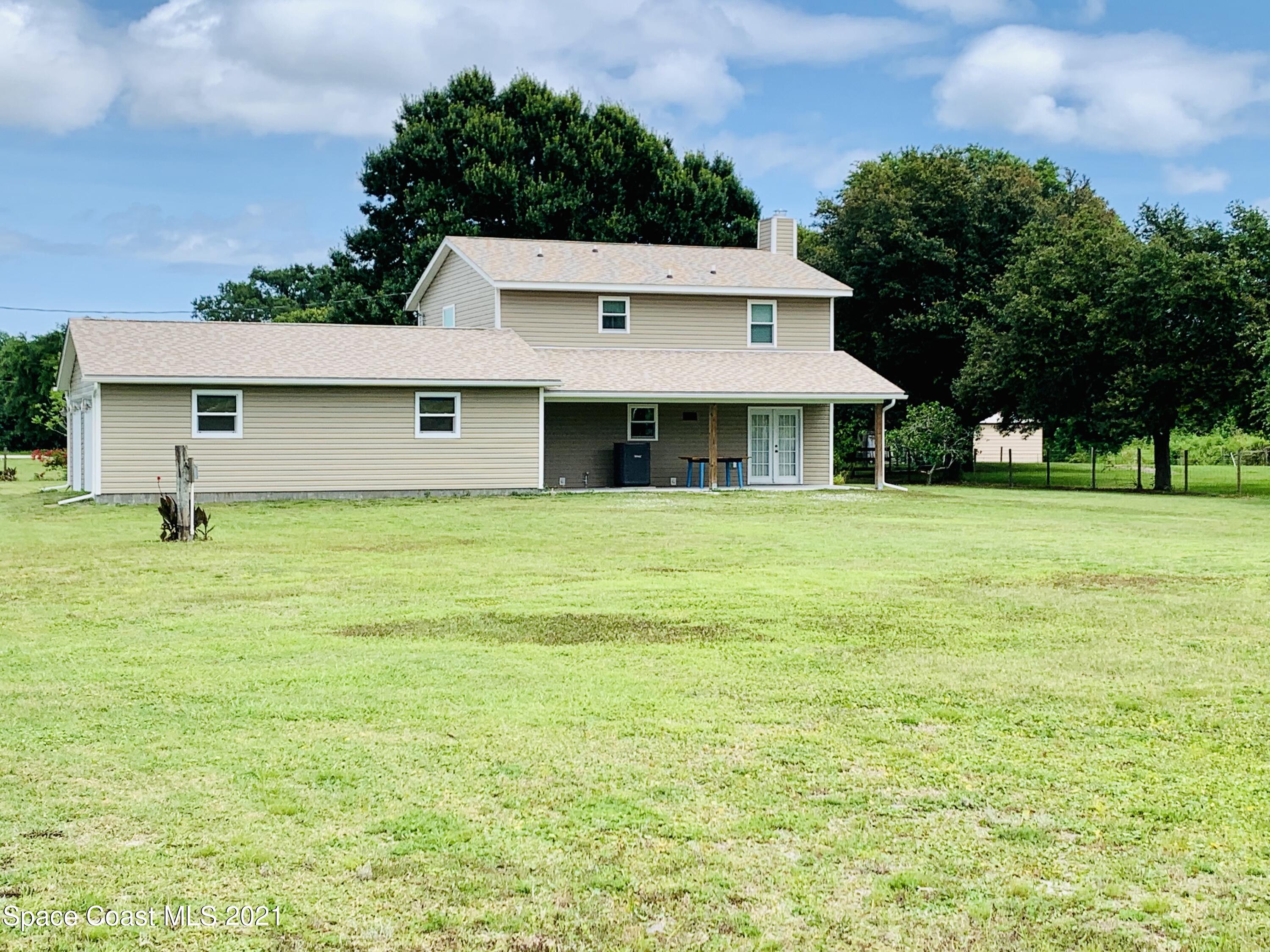 3155 Lionel Road Mims, FL 32754 - Photo 21 of 61 rear view