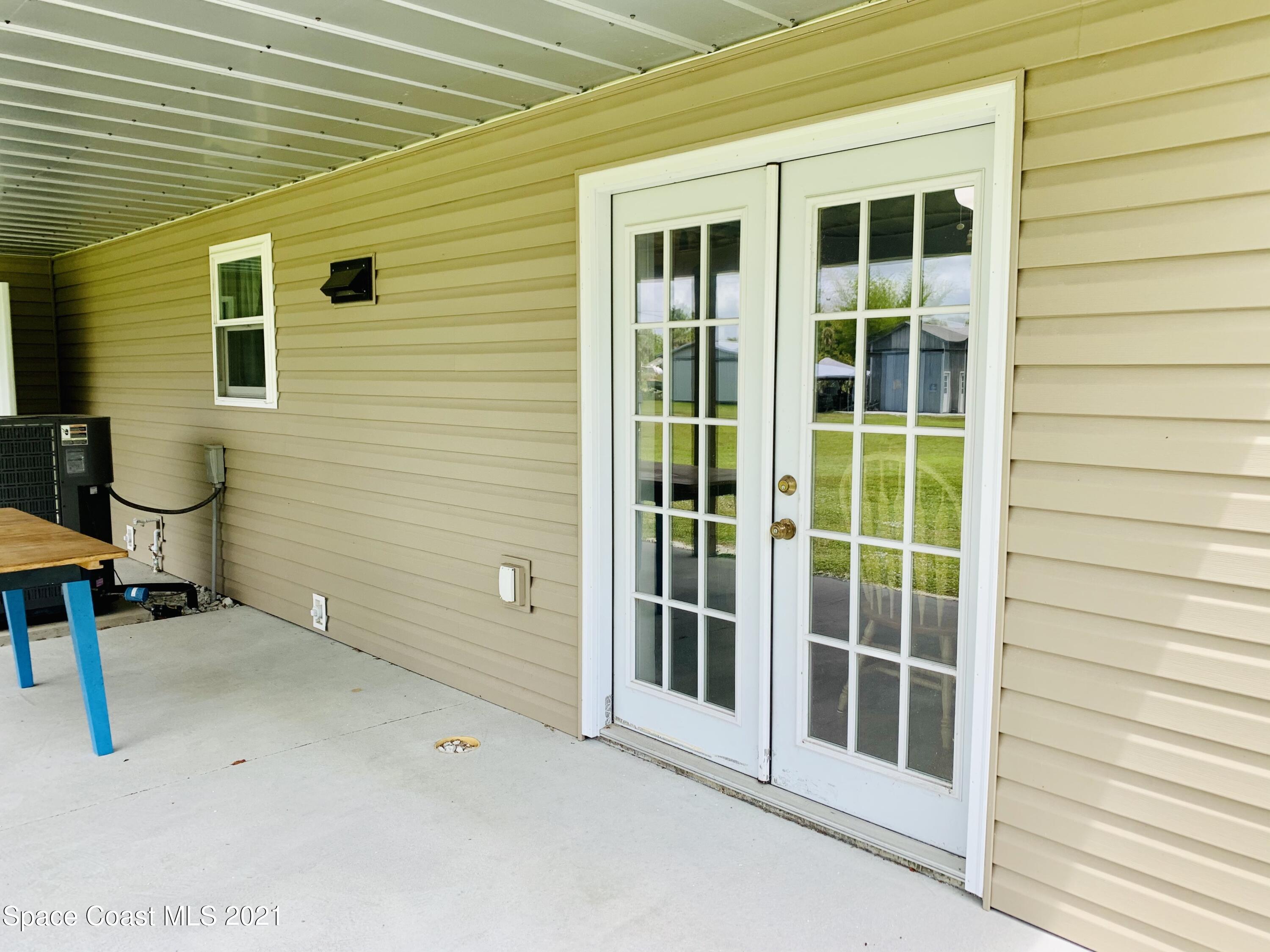 3155 Lionel Road Mims, FL 32754 - Photo 38 of 61 back lanai