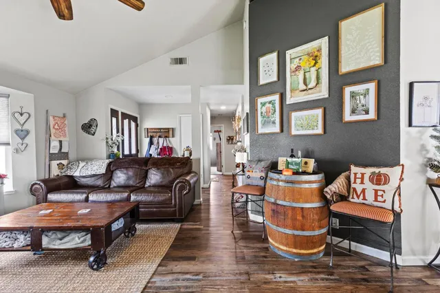 a living room with furniture and a table