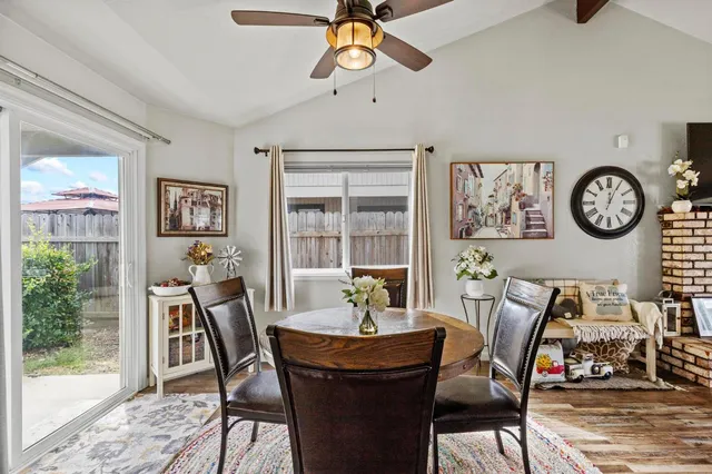 a dining room with furniture and window