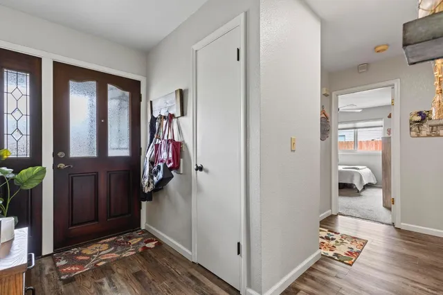 a view of entryway with wooden floor