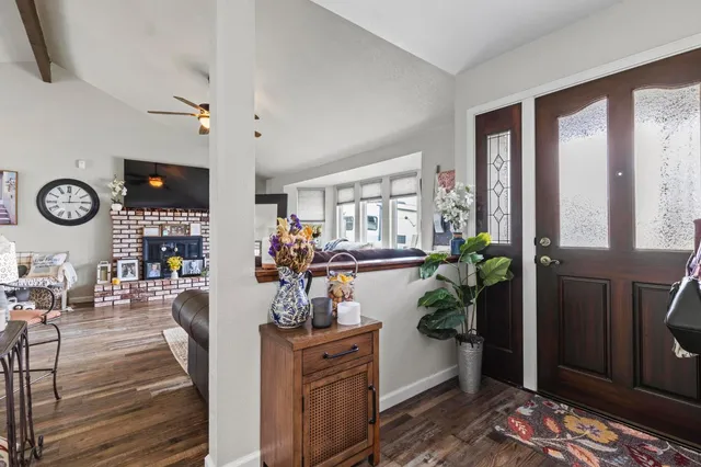 a view of living room filled with furniture and window