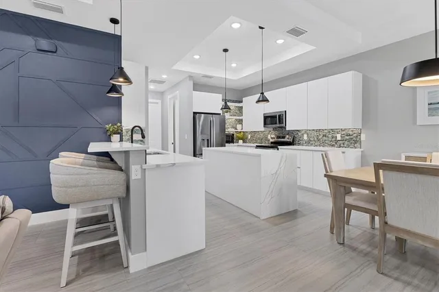 a dining room with furniture and wooden floor