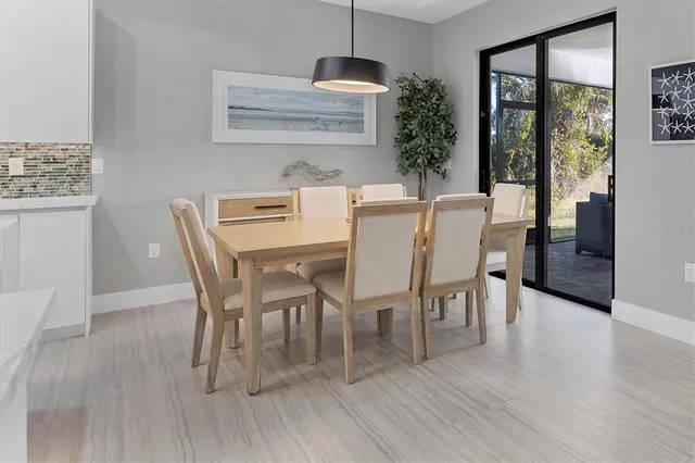 a large kitchen with kitchen island a sink a counter space stainless steel appliances and cabinets