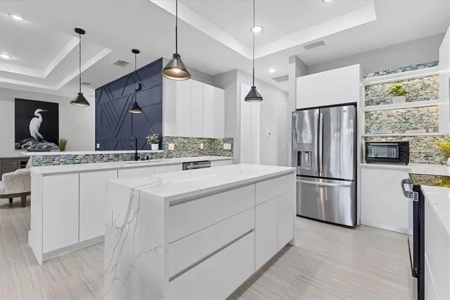 a kitchen with windows and a fireplace