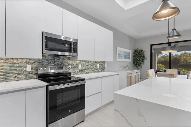 a kitchen with a sink and a refrigerator