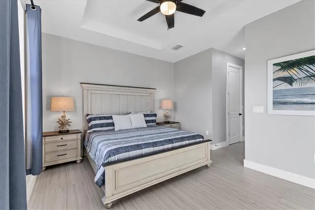 a bedroom with a large bed and a large window