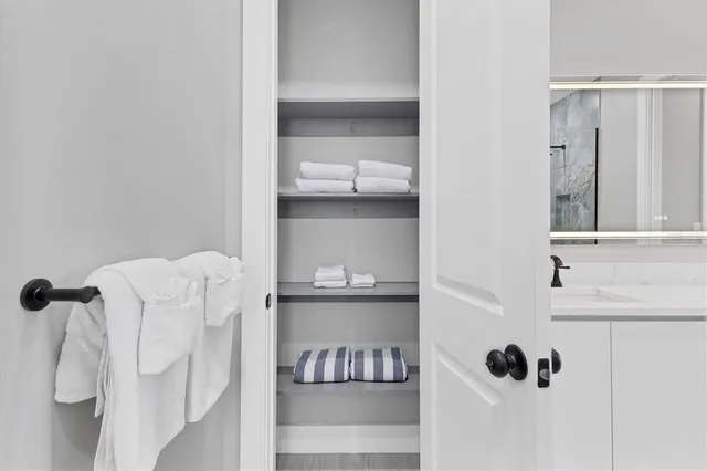 a bathroom with a double vanity sink and mirror