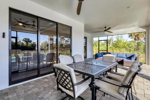 a view of a dining room with furniture window and outside view