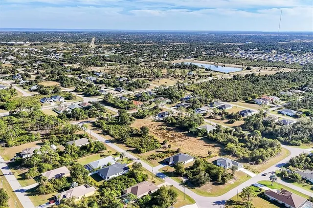 a view of a swimming pool with a yard