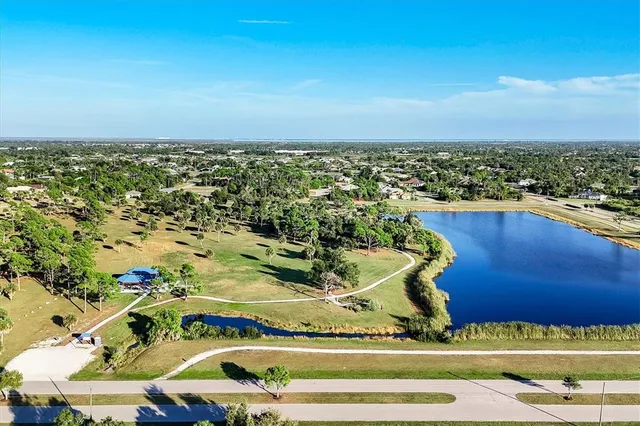 an aerial view of residential houses with city view