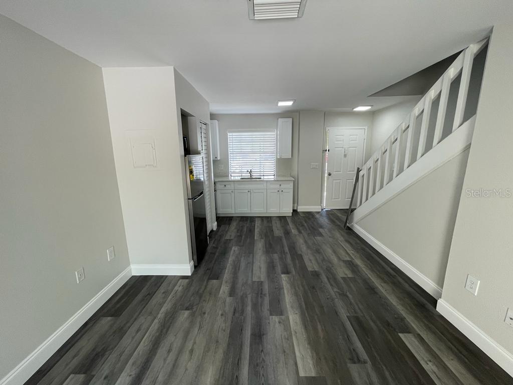 10260 Turkey Lake Road, Unit 150 (A30) Orlando, FL 32819 - Photo 4 of 13 a view of entryway with wooden floor