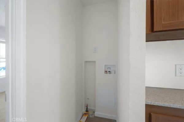 a view of a kitchen from the hallway