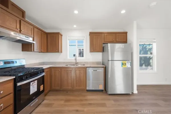 a kitchen with a stove and a sink