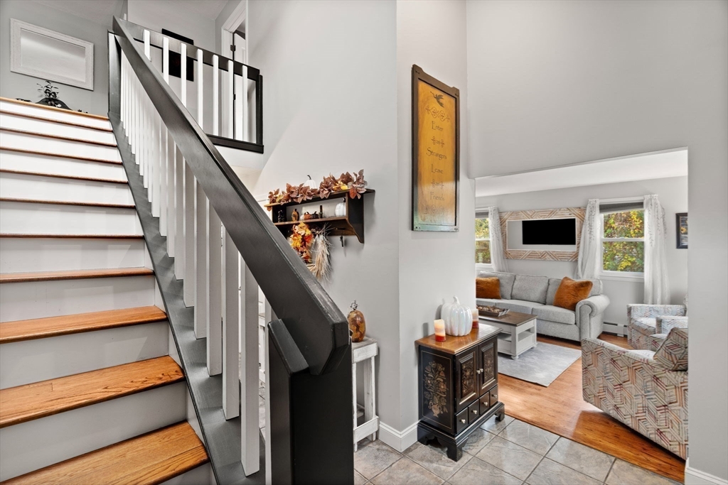 12 Dixfield Road Worcester, MA 01606 - Photo 15 of 42 a living room with furniture and stairs