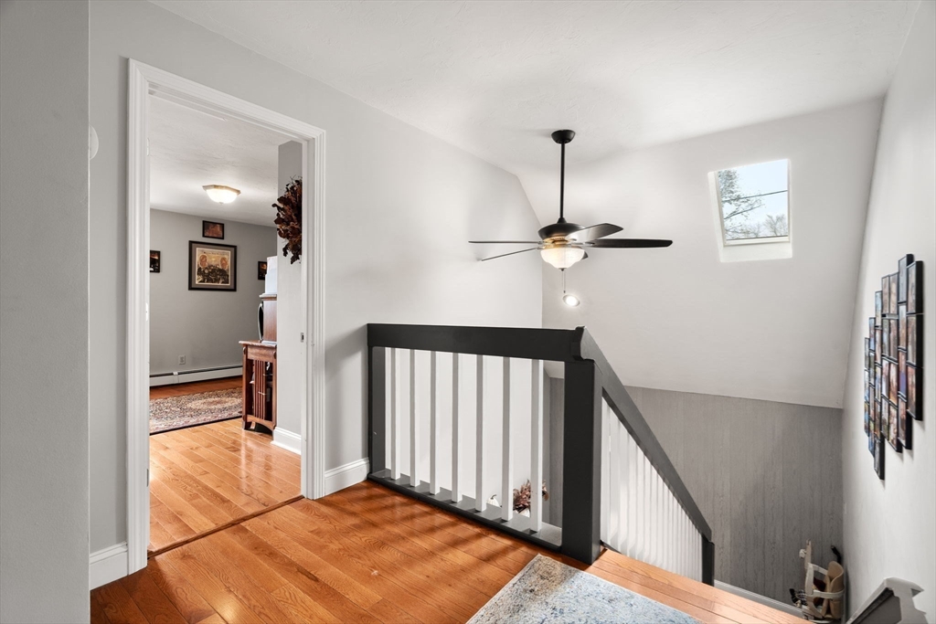 12 Dixfield Road Worcester, MA 01606 - Photo 17 of 42 a bedroom with furniture and a chandelier