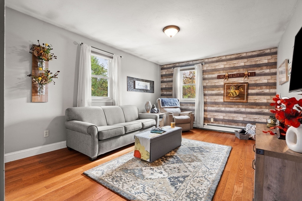 12 Dixfield Road Worcester, MA 01606 - Photo 18 of 42 a living room with furniture and a rug