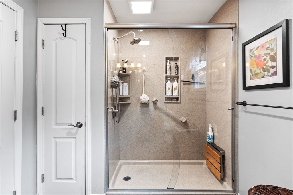 12 Dixfield Road Worcester, MA 01606 - Photo 28 of 42 a bathroom with a glass shower door