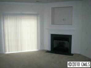 2135 Midnight Blue Lane, Unit 2135 Fort Mill, SC 29708 - Photo 4 of 7 a view of an empty room with a fireplace
