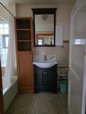 a bathroom with a sink and a mirror