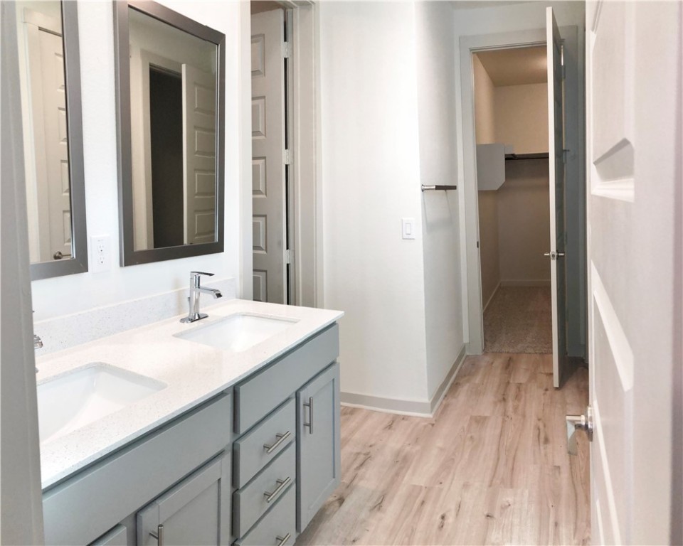 640 Peace Pipe Way Georgetown, TX 78628 - Photo 12 of 24 a bathroom with a sink a mirror and a shower