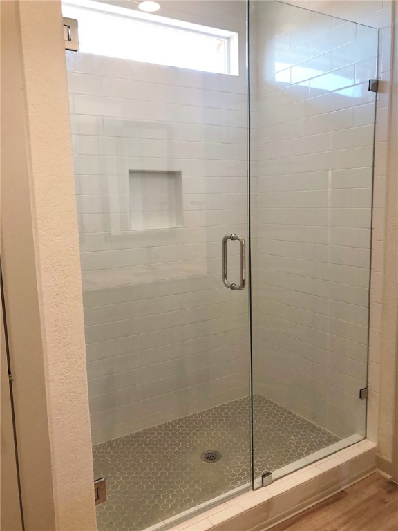 640 Peace Pipe Way Georgetown, TX 78628 - Photo 13 of 24 a bathroom with a glass shower door