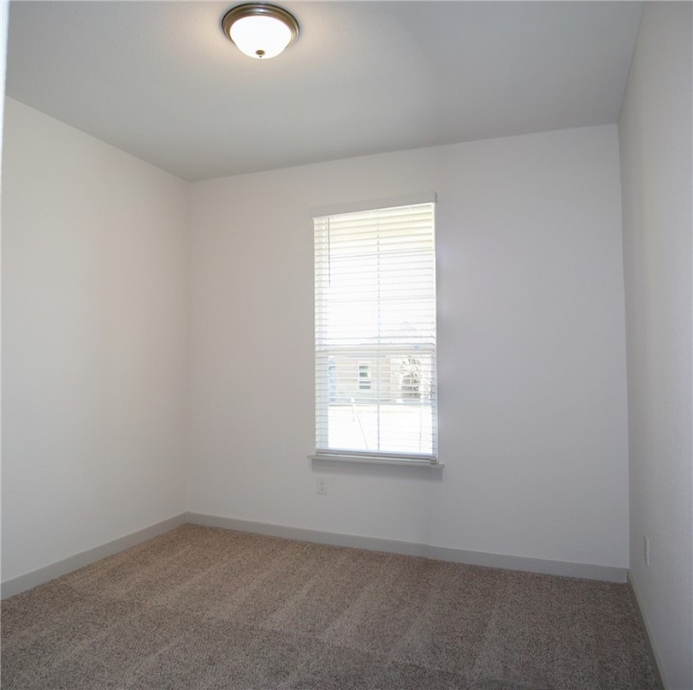 640 Peace Pipe Way Georgetown, TX 78628 - Photo 16 of 24 an empty room with a window