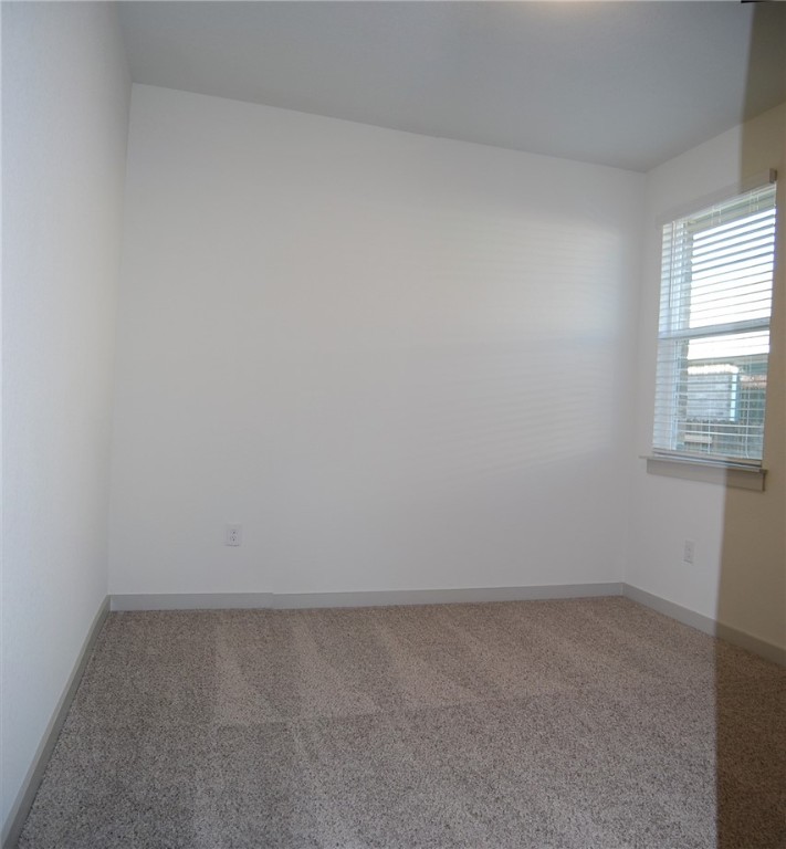 640 Peace Pipe Way Georgetown, TX 78628 - Photo 17 of 24 an empty room with a window