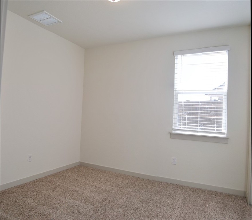 640 Peace Pipe Way Georgetown, TX 78628 - Photo 18 of 24 an empty room with a window