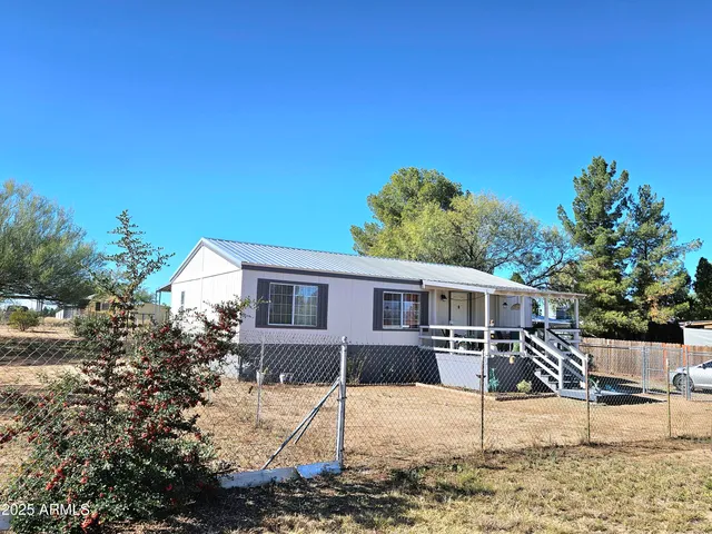 a house view with a backyard space