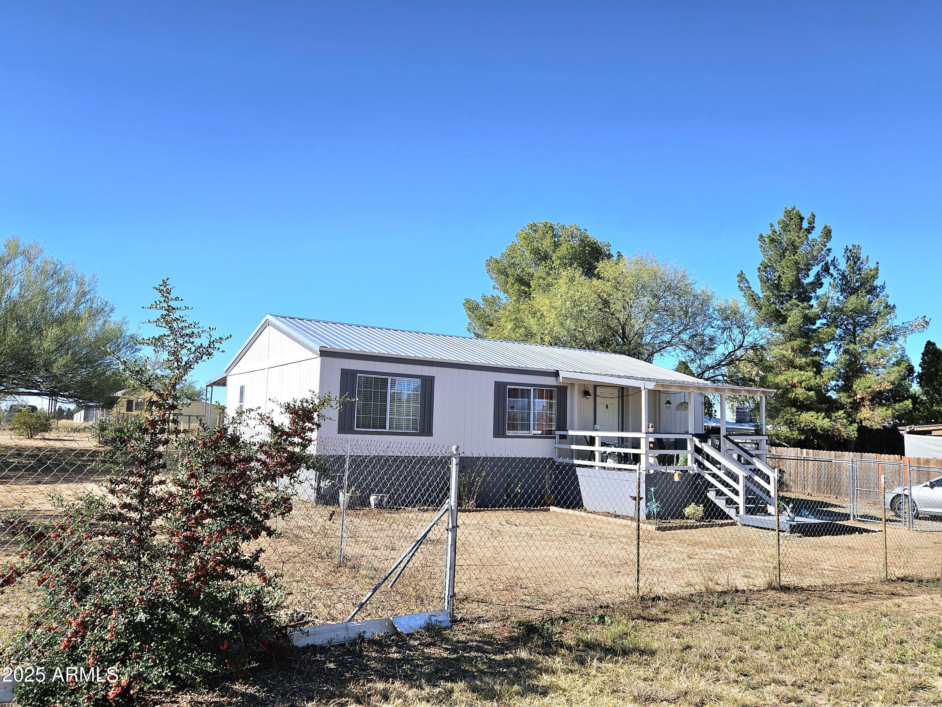 a house view with a backyard space