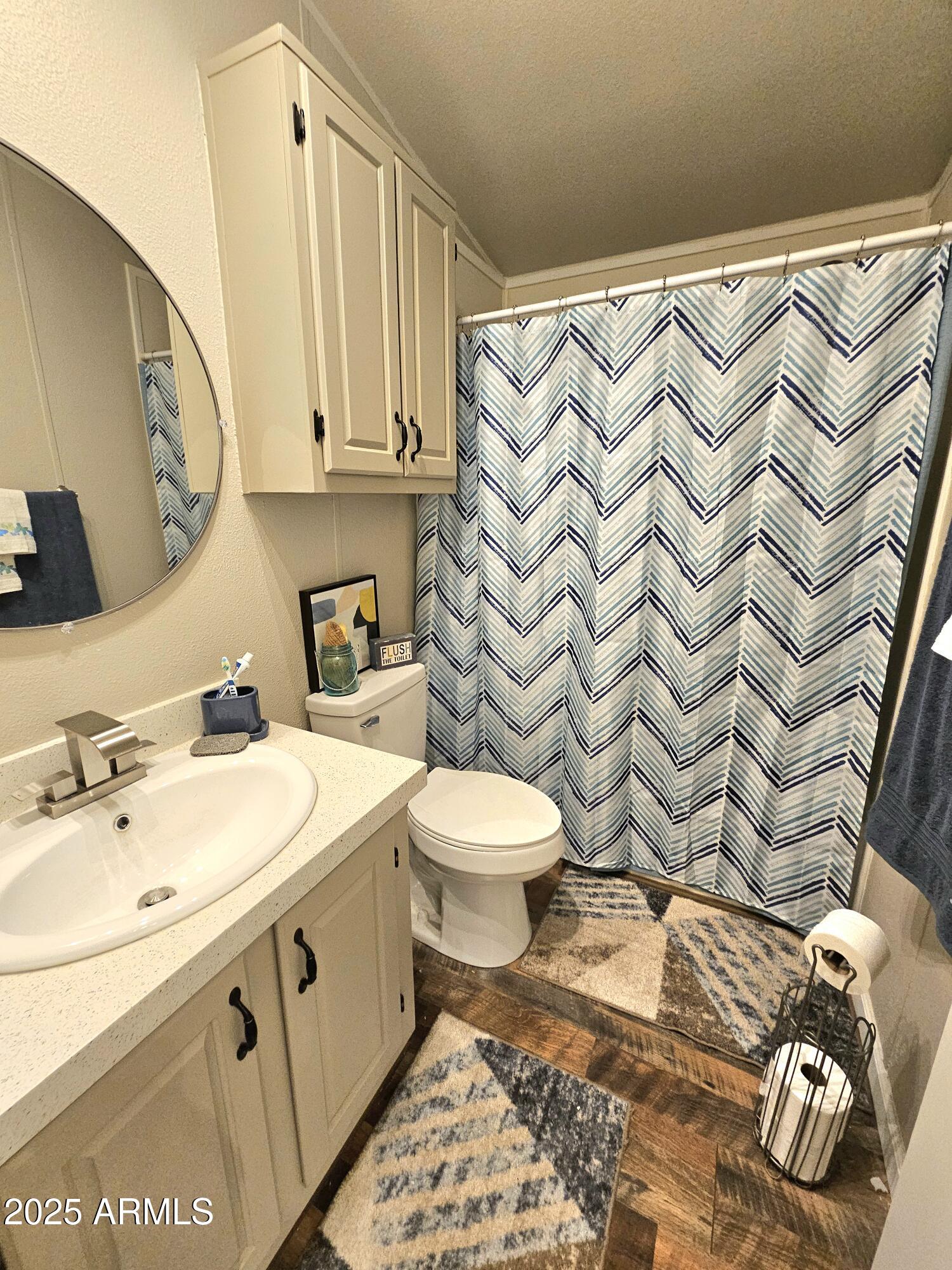 284 North Warren Road Benson, AZ 85602 - Photo 17 of 33 a bathroom with a sink and a mirror