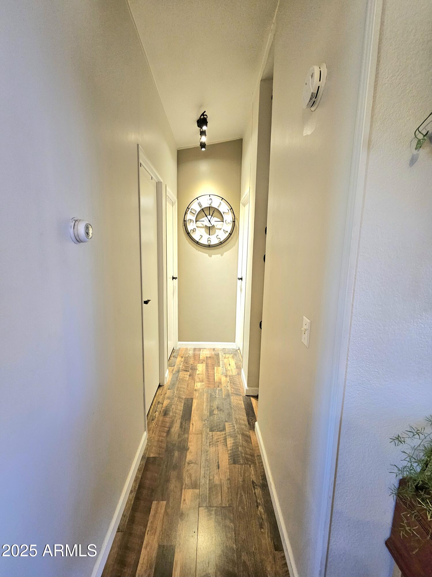 284 North Warren Road Benson, AZ 85602 - Photo 18 of 33 a view of hallway with wooden floor