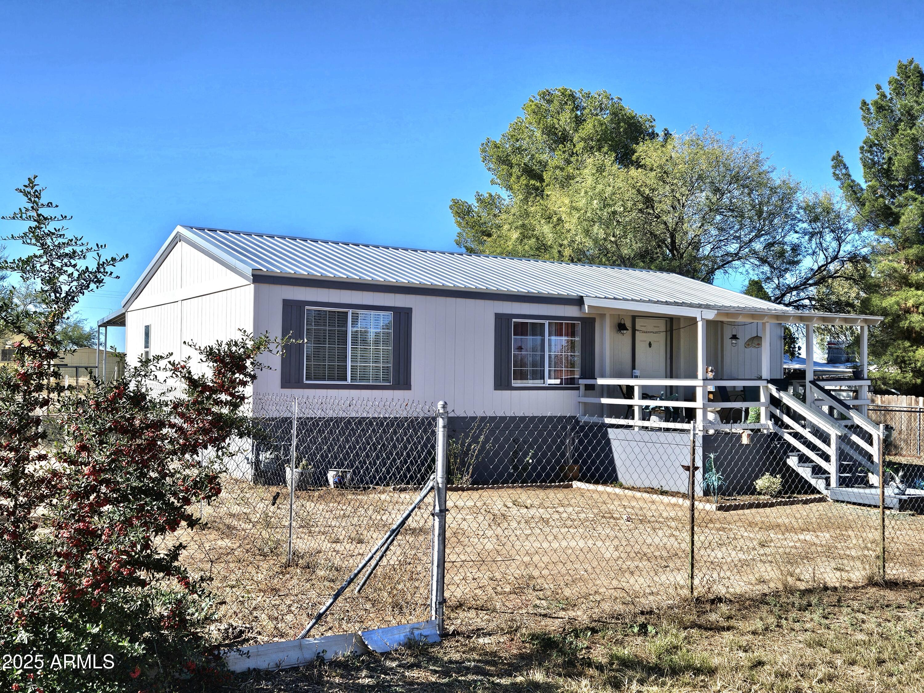 284 North Warren Road Benson, AZ 85602 - Photo 2 of 33 a view of a house with a yard