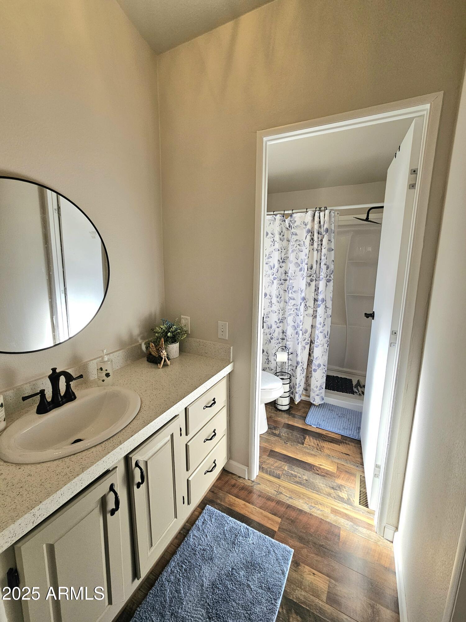 284 North Warren Road Benson, AZ 85602 - Photo 24 of 33 a bathroom with a double vanity sink and a mirror