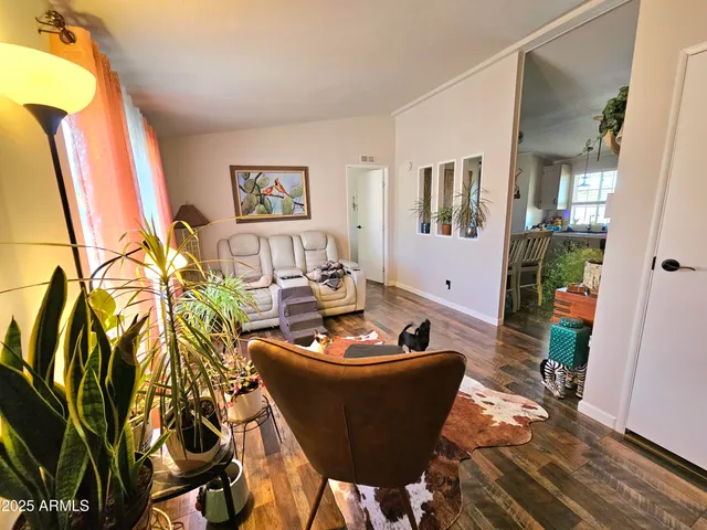 a view of a patio with a table chairs and a backyard