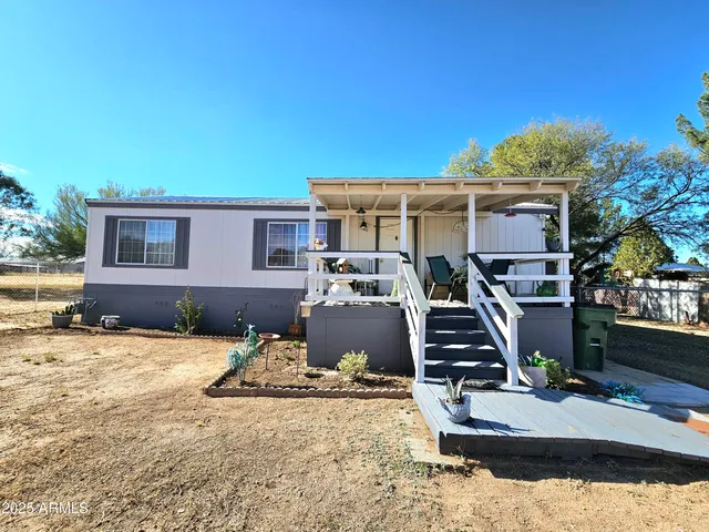 swimming pool view with a seating space