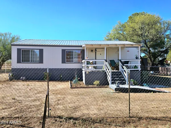 a view of a house with large windows