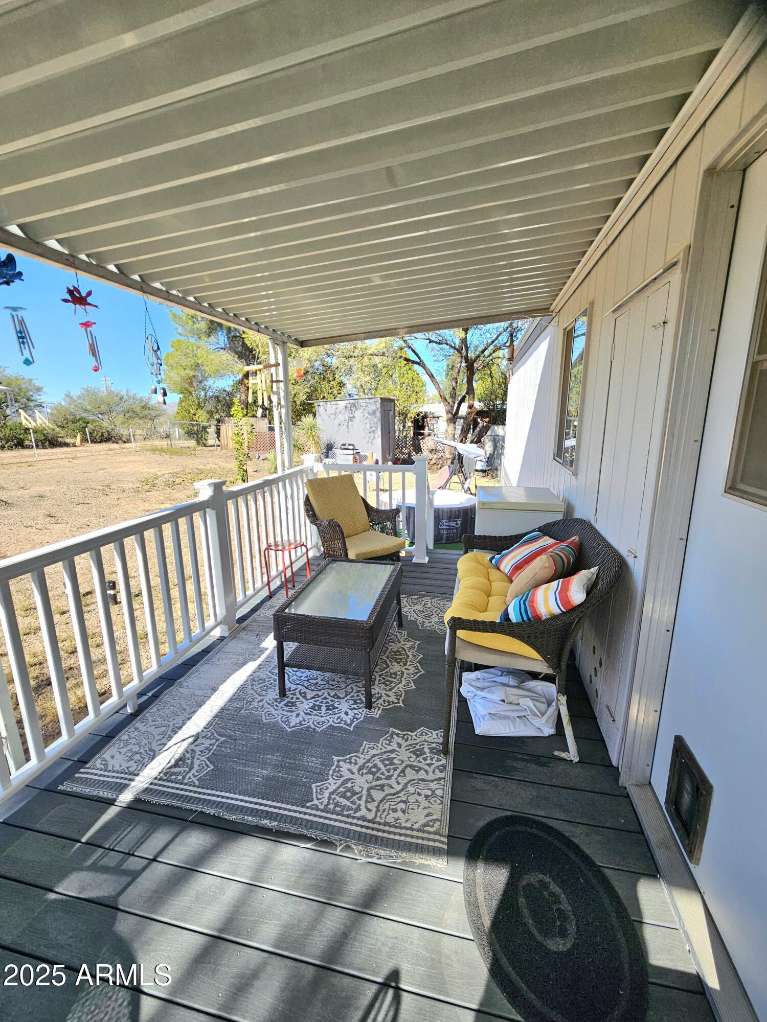 284 North Warren Road Benson, AZ 85602 - Photo 31 of 33 a balcony with furniture and a potted plant