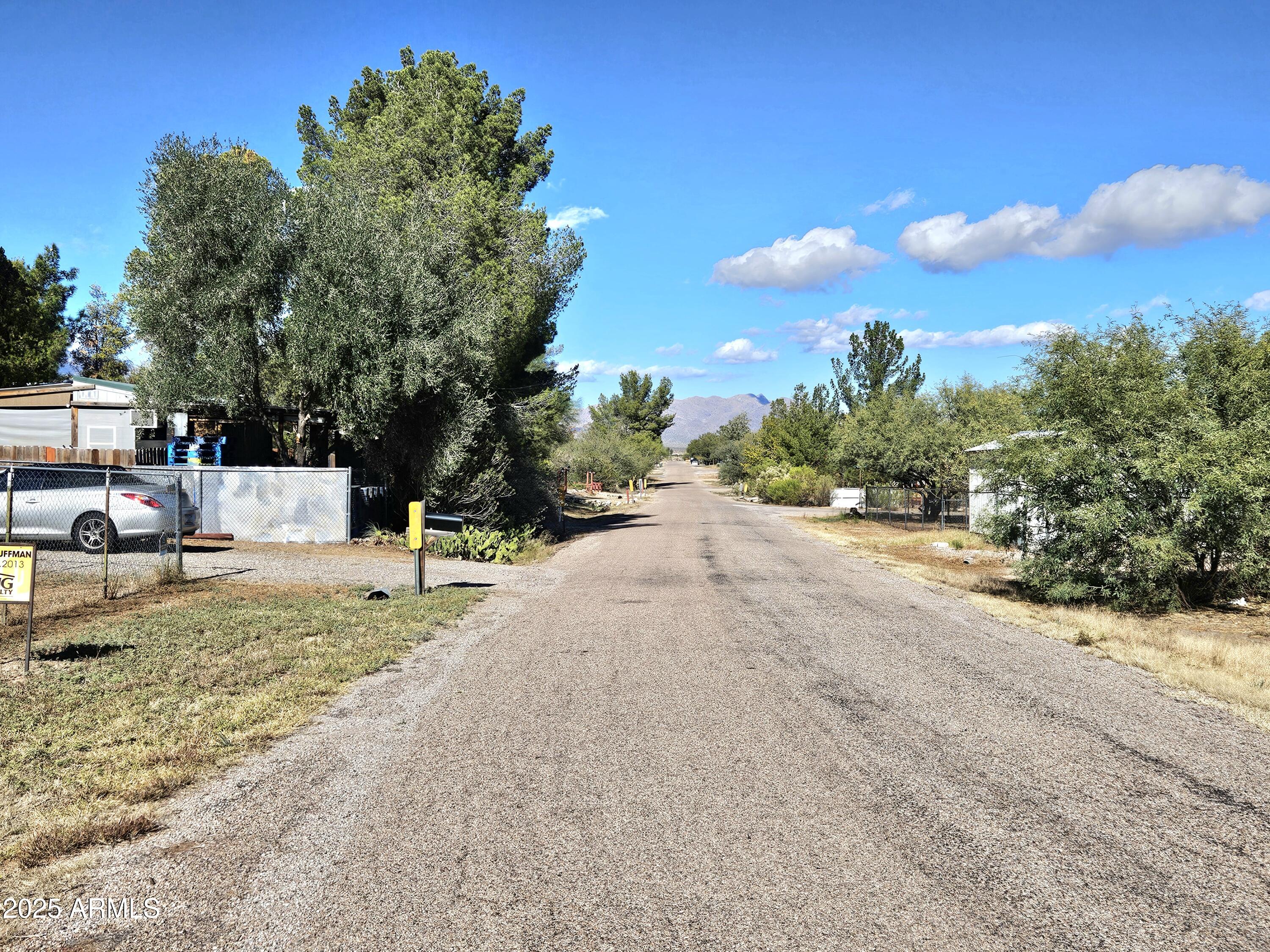 284 North Warren Road Benson, AZ 85602 - Photo 4 of 33 a view of a yard with tiny play house