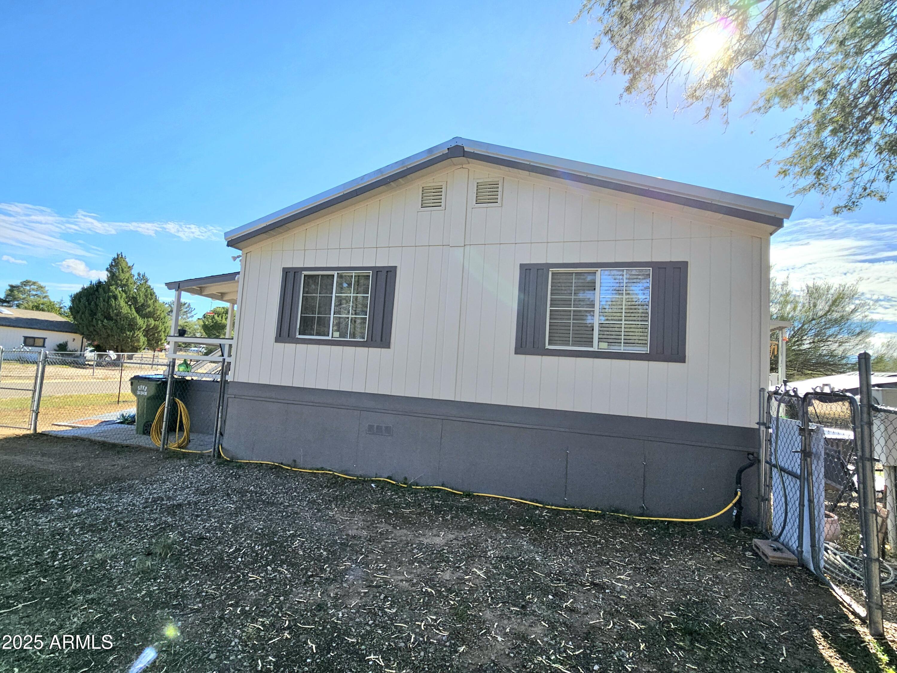 284 North Warren Road Benson, AZ 85602 - Photo 5 of 33 a view of a backyard with a garden and yard