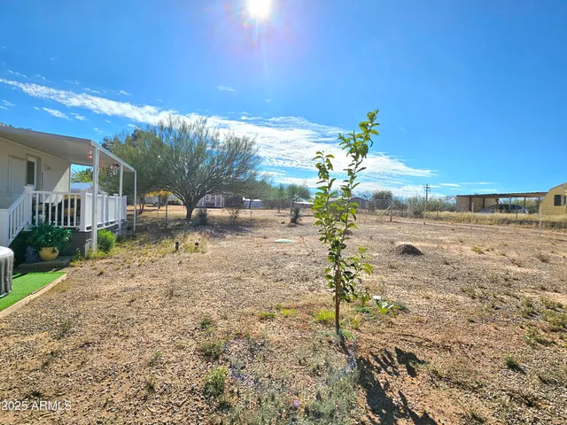 a view of a yard with an outdoor space